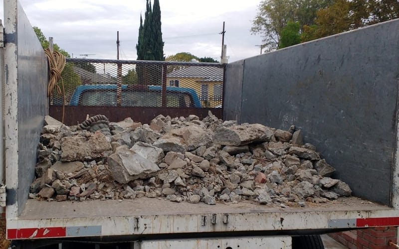 Truck bed loaded with broken concrete and masonry from a Largo demolition job