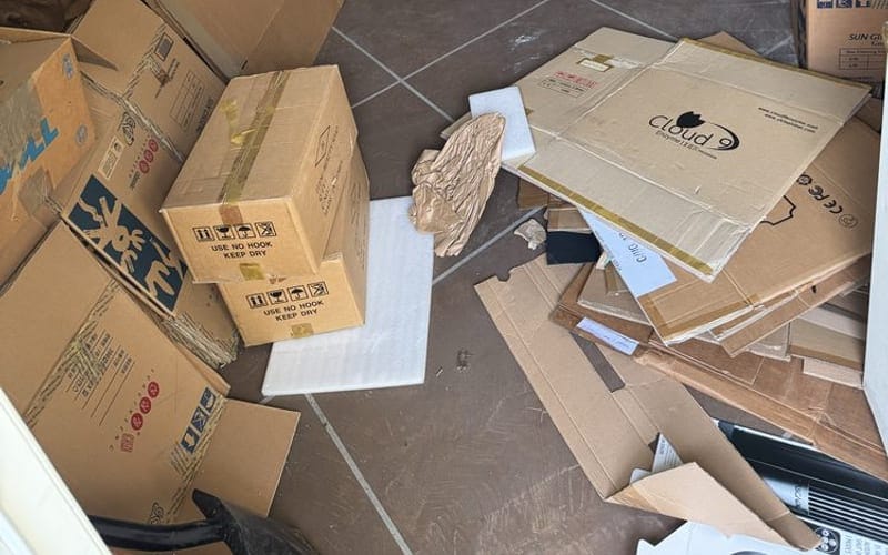 Boxed household goods set aside for donation after a Largo, FL cleanout